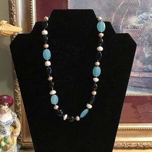 Lovely faux pearl and beaded necklace to dress up or down!